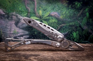 Multi purpose tool with woods in the background Multi purpose tool with woods in the background