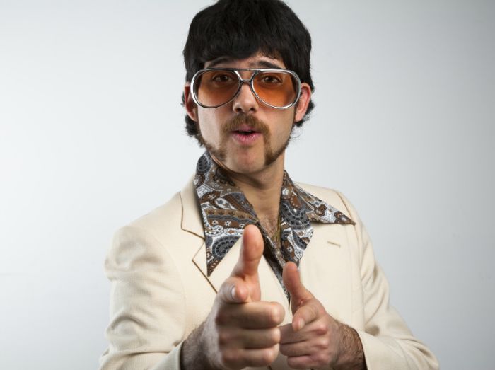 Guy wearing a retro polyester suit Guy wearing a retro polyester suit